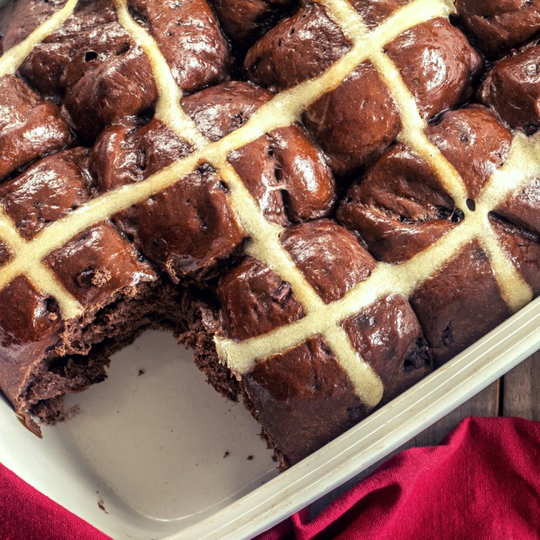 chocolate hot cross buns in a baking tray