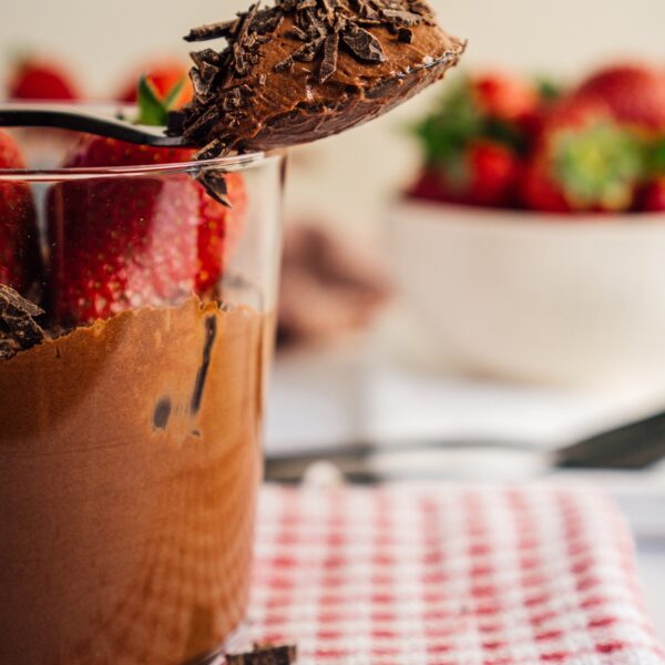 dark chocolate mouse with strawberries in glass