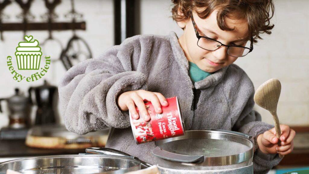 boy using Food Thoughts cocoa powder for baking