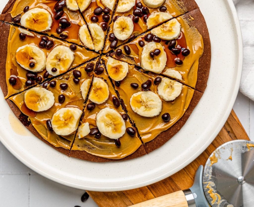 chocolate pancake pizza with peanut butter and banana sliced