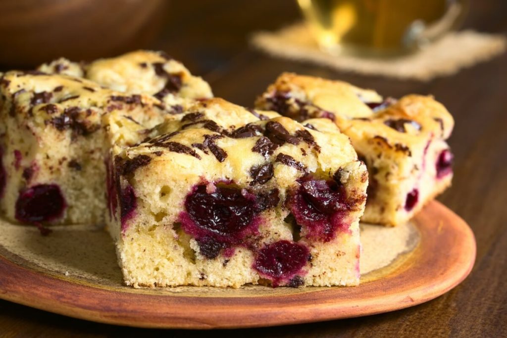 white chocolate cherry blondies square on a plate