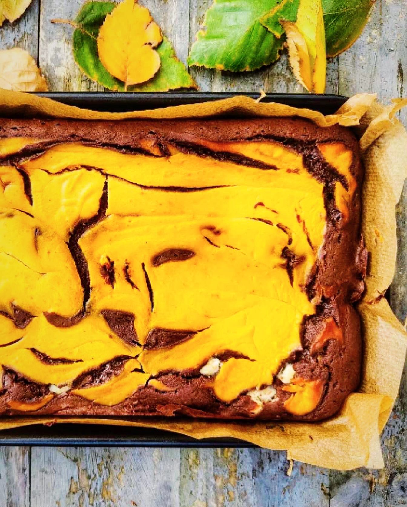 🥕 Is it a fruit or is it a vegetable? Who cares? With less than a week before these beauties disappear from the stores, we're on a mission to celebrate them with as many recipes as we can. Today we're sharing @theyorkshiregourmet ‘s real pleasure teaser: Pumpkin Caramel Cheesecake Brownies 🧡

Layers of rich chocolate brownie, swirled with velvety pumpkin caramel cheesecake goodness. 

Ingredients: 200g unsalted butter | 200g @foodthoughtsuk dark chocolate chips | 1,400g tin caramel | 1 tsp rock salt | 200g golden caster sugar | 5 medium eggs | 130g plain flour | 50g @foodthoughtsuk organic cocoa powder | 200g cream cheese | 75g pumpkin purée

Method:
Preheat the oven to 180C.
Melt the butter and chocolate gently in a pan.
Beat 4 eggs, sugar, caramel, and salt until well combined. Whisk in the melted chocolate butter mixture.
Fold through the flour and cocoa powder.
Spoon half of the brownie batter into the greased tin. Add a layer of the remaining caramel and top with the rest of the brownie mix.
In a bowl, combine the cream cheese with the last egg, pumpkin puree, and mixed spice. Use a knife to swirl this mixture through the top of the brownies.
Bake for 35-45 minutes or until a toothpick comes out with a few moist crumbs.

What is YOUR twist on the classic pumpkin-chocolate combo? ‍

Follow @theyorkshiregourmet for more mouthwatering creations 📸🤤
