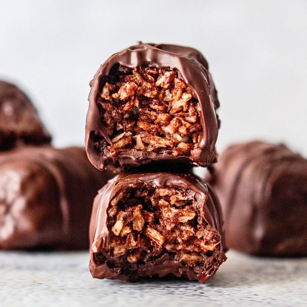 Healthier bounty bites made with double chocolate and coconut, stacked up and looking delicious