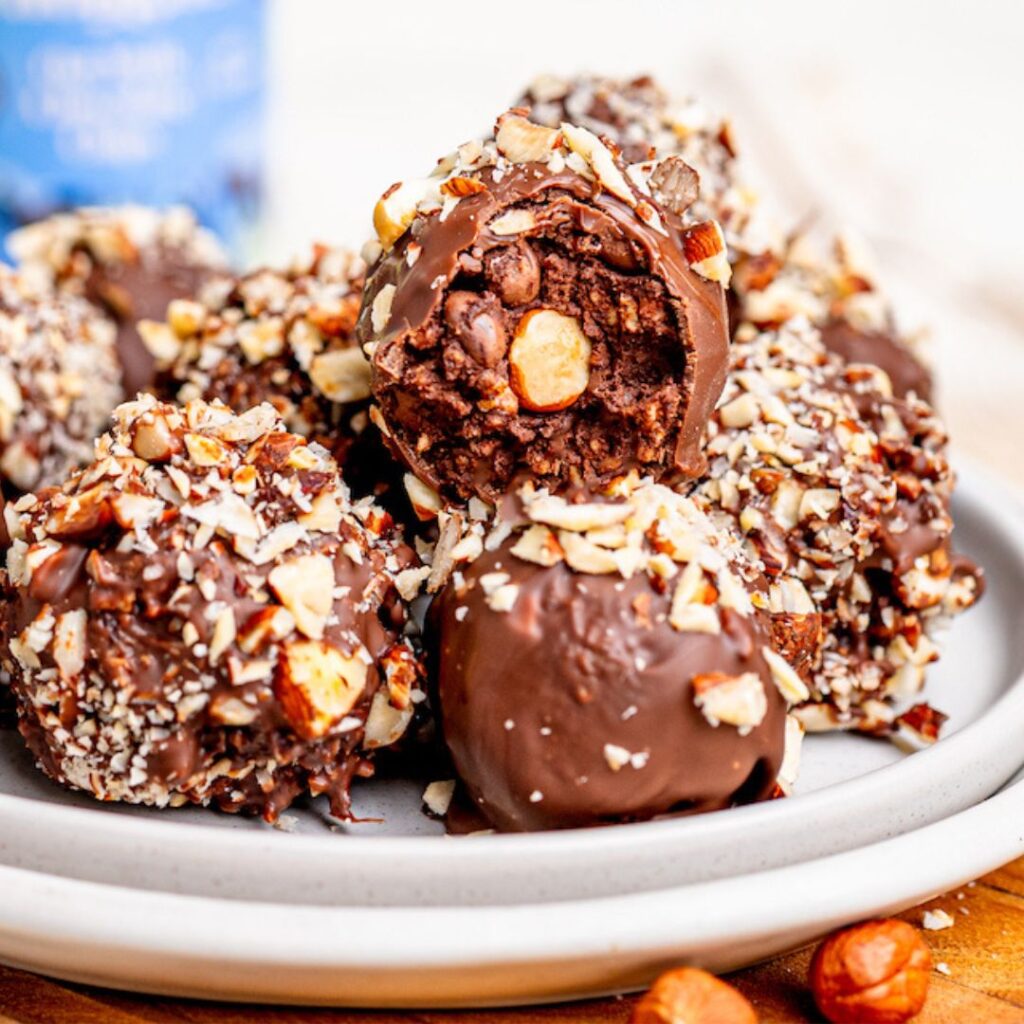 Healthy homemade Ferrero Rocher balls stacked on a plate looking delicious