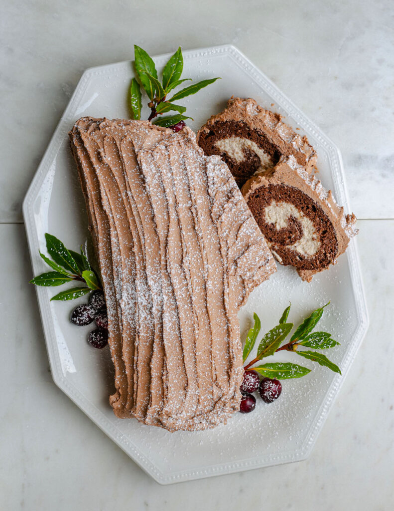 Chocolate and chestnut yule log in a serving plate looking amazing